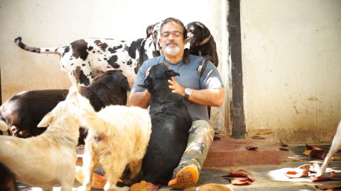 Rakesh Shukla at the VOSD sanctuary with a few of his dogs.