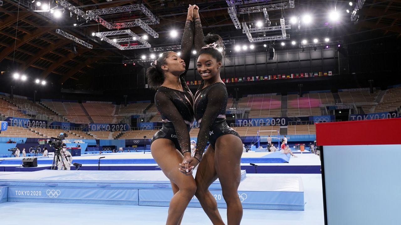 Simone Biles poses for pictures with her teammate Jordan Chiles at the 2020 Summer Olympics, in Tokyo, Japan.