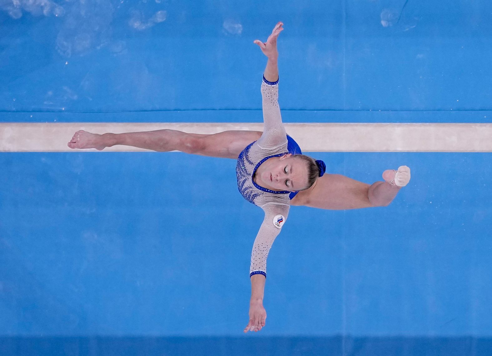 Russian gymnast Viktoria Listunova performs on the balance beam during the team all-around competition on July 27. She <a href="index.php?page=&url=https%3A%2F%2Fwww.cnn.com%2Fworld%2Flive-news%2Ftokyo-2020-olympics-07-27-21-spt%2Fh_8916e07951f273460cfa89cee9100a9a" target="_blank">won the gold medal</a> along with her teammates Vladislava Urazova, Angelina Melnikova and Lilia Akhaimova. Russian athletes at these Olympics are officially recognized as members of ROC, an abbreviation of the Russian Olympic Committee. That's because in 2019, the World Anti-Doping Agency <a href="index.php?page=&url=https%3A%2F%2Fwww.cnn.com%2F2021%2F07%2F26%2Fsport%2Fwhat-is-roc-olympics-explainer-spt-trnd%2Findex.html" target="_blank">banned Russia</a> from all international sporting competitions, including the Olympics, for doping non-compliance. Russian athletes can't compete under their country's name, flag and national anthem until December 2022.