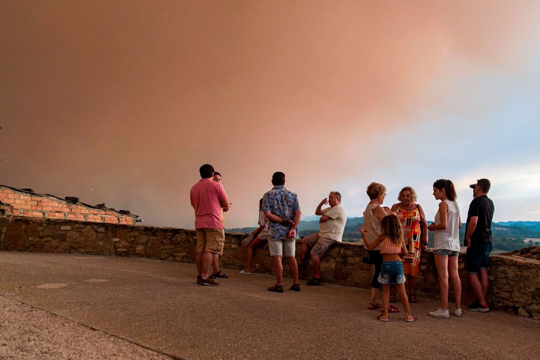 Locals watch fires spread in Sant Martí de Tous, Catalonia.
