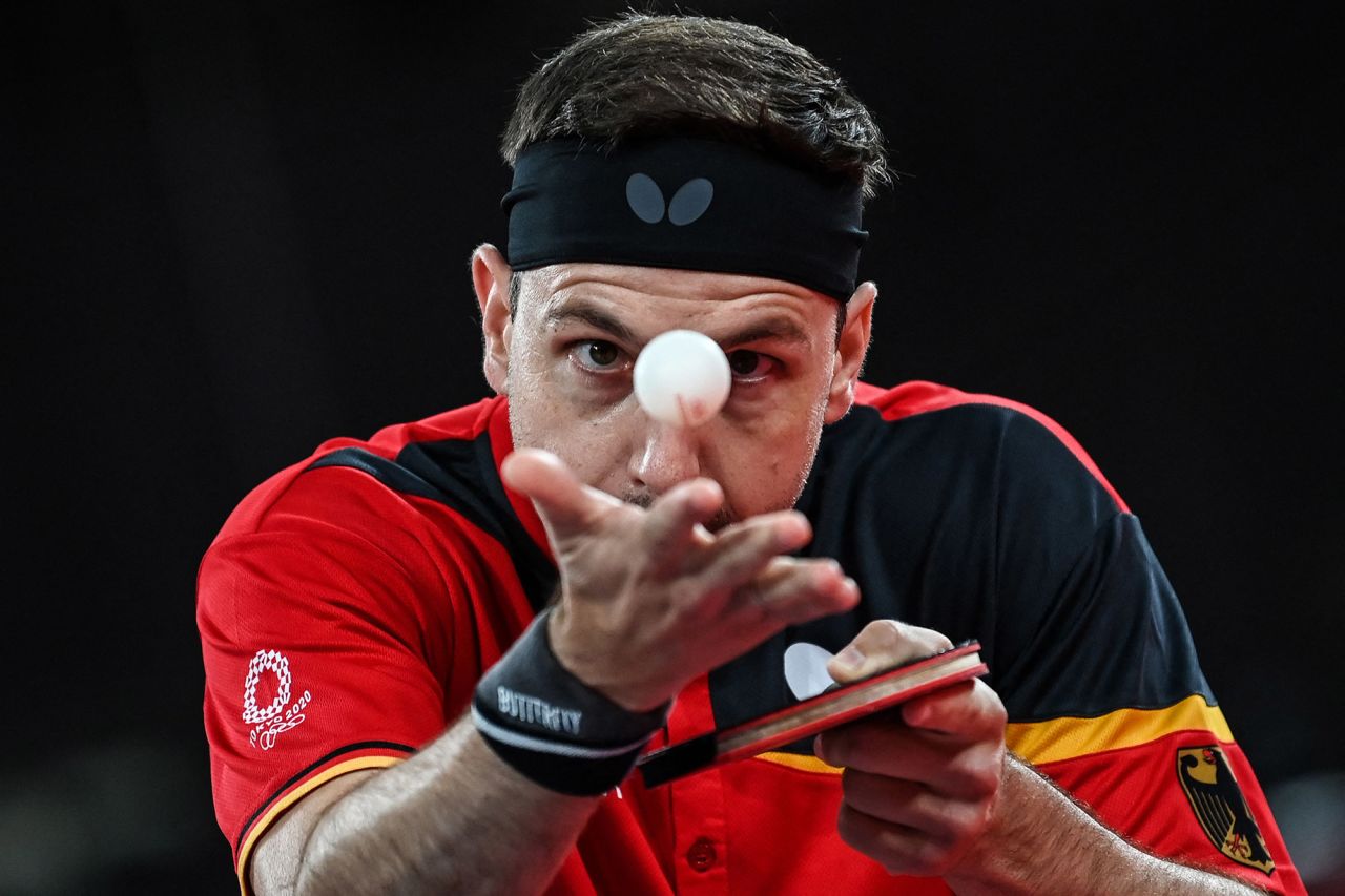 German table-tennis player Timo Boll serves during a match on July 27.