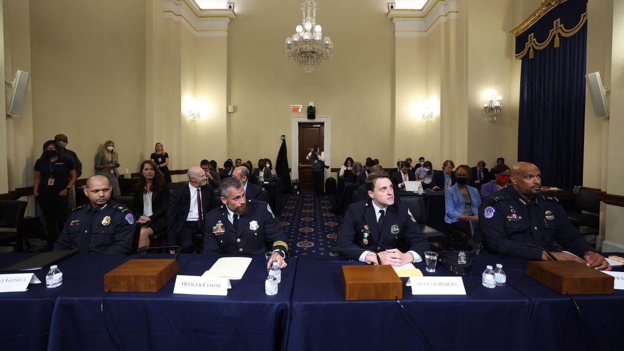 From left, US Capitol Police Sgt. Aquilino Gonell, Washington Metropolitan Police Department Officer Michael Fanone, Washington Metropolitan Police Department Officer Daniel Hodges and US Capitol Police Officer Harry Dunn arrive to testify at the House select committee hearing on the January 6 attack on Capitol Hill in Washington, Tuesday, July 27, 2021. 