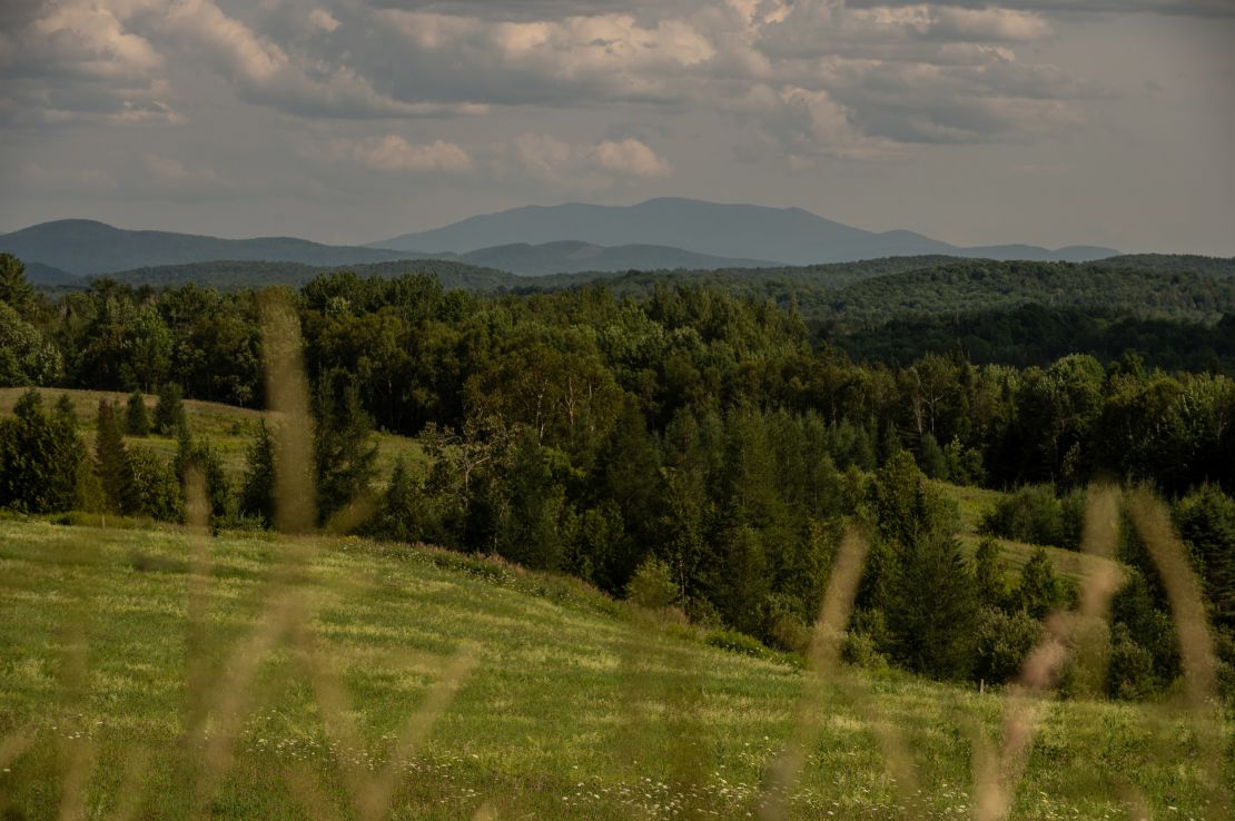 Mountains rise over the Vermont countryside in Caledonia County. Neighboring Essex County has the lowest vaccination rate in the state.
