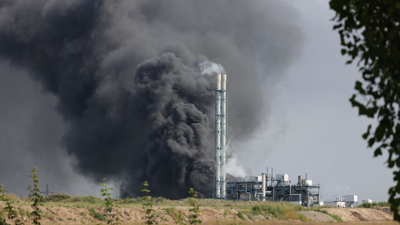 Clouds of dark smoke rise above the Chempark site.