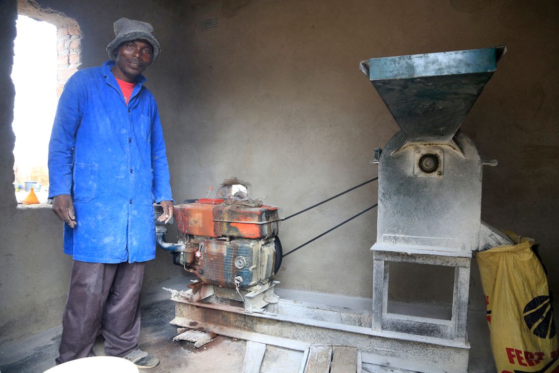 Alfred Makumbe at his grinding mill. His business has been affected by Covid.