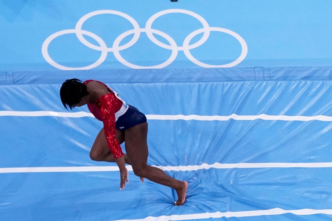 Simone Biles stumbles as she lands on the vault during the artistic gymnastics women's final at the 2020 Summer Olympics.