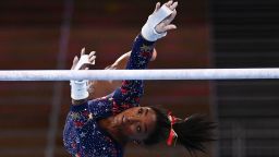 TOPSHOT - USA's Simone Biles competes in the uneven bars event of the  artistic gymnastics women's qualification during the Tokyo 2020 Olympic Games at the Ariake Gymnastics Centre in Tokyo on July 25, 2021. (Photo by Martin BUREAU / AFP) (Photo by MARTIN BUREAU/AFP via Getty Images)