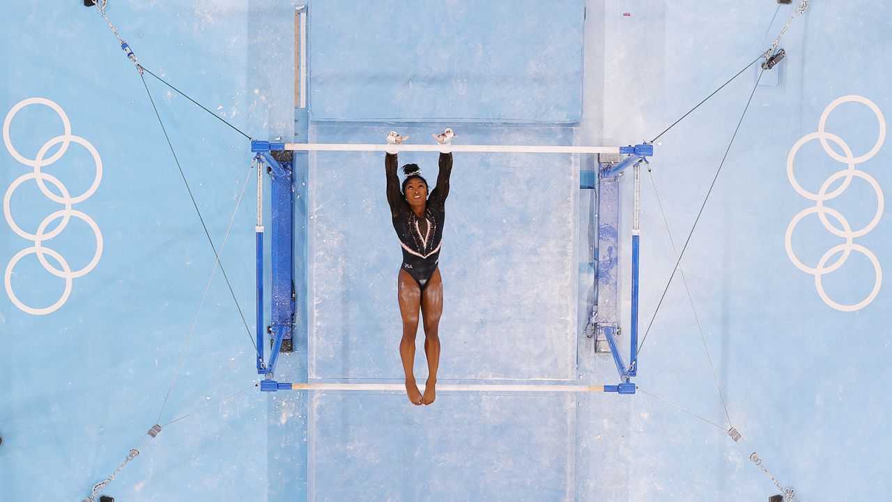 Biles trains on the uneven bars ahead of the Tokyo 2020 Olympic Games on Thursday, July 22.