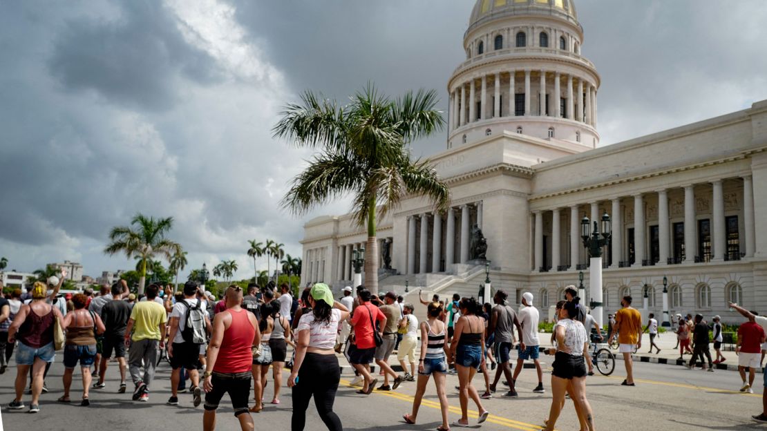 Cubans march in front of Havana's Capitol during a demonstration against the government of Cuban President Miguel Diaz-Canel in Havana, on July 11, 2021. 