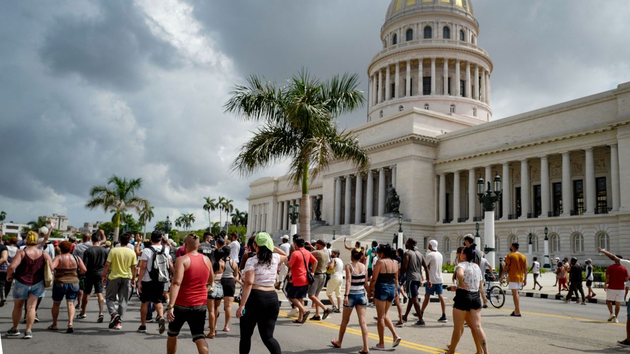 Thousands of Cubans have taken part in rare protests against the communist government, marching and chanting "Down with the dictatorship" and "We want liberty." 
