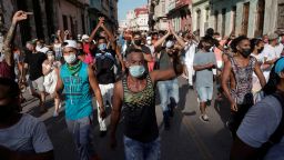 People shout slogans for and against the government during a protest amid the coronavirus outbreak in Havana.