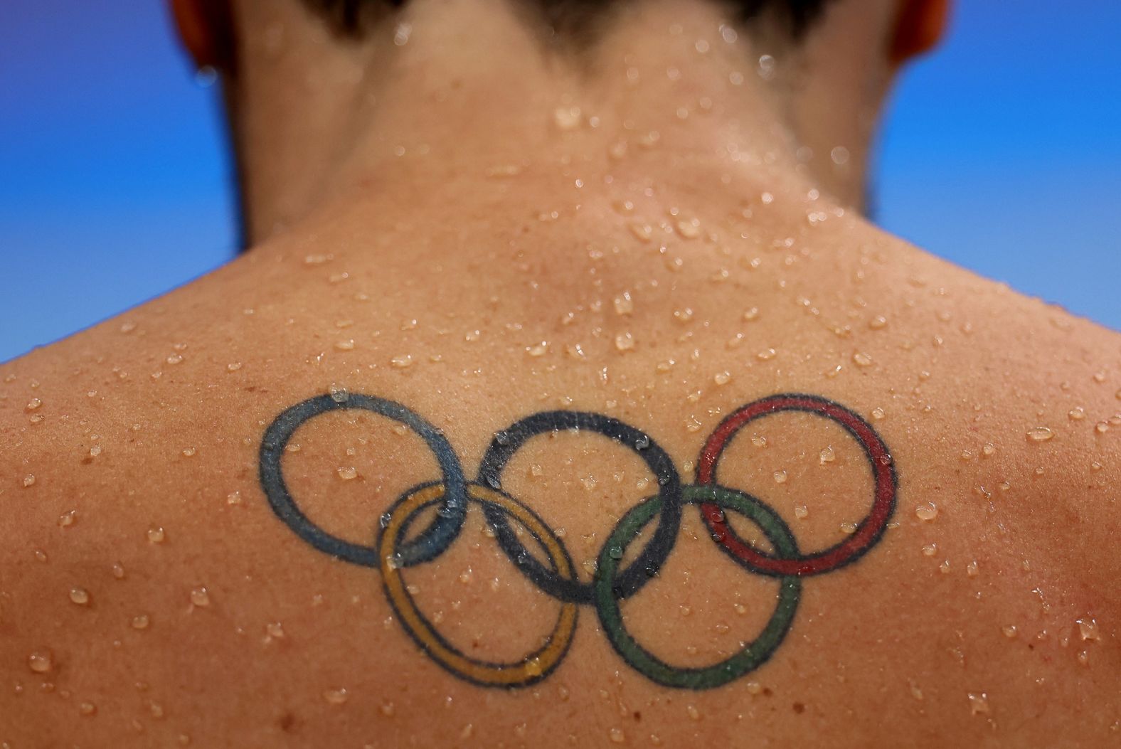 A tattoo of the Olympic rings is seen on the back of South African swimmer Brad Tandy on July 27. Many of this year's athletes <a href="index.php?page=&url=https%3A%2F%2Fwww.cnn.com%2Fstyle%2Farticle%2Folympics-tokyo-tattoos-trnd-spt%2Findex.html" target="_blank">are sporting a wide range of ink.</a>
