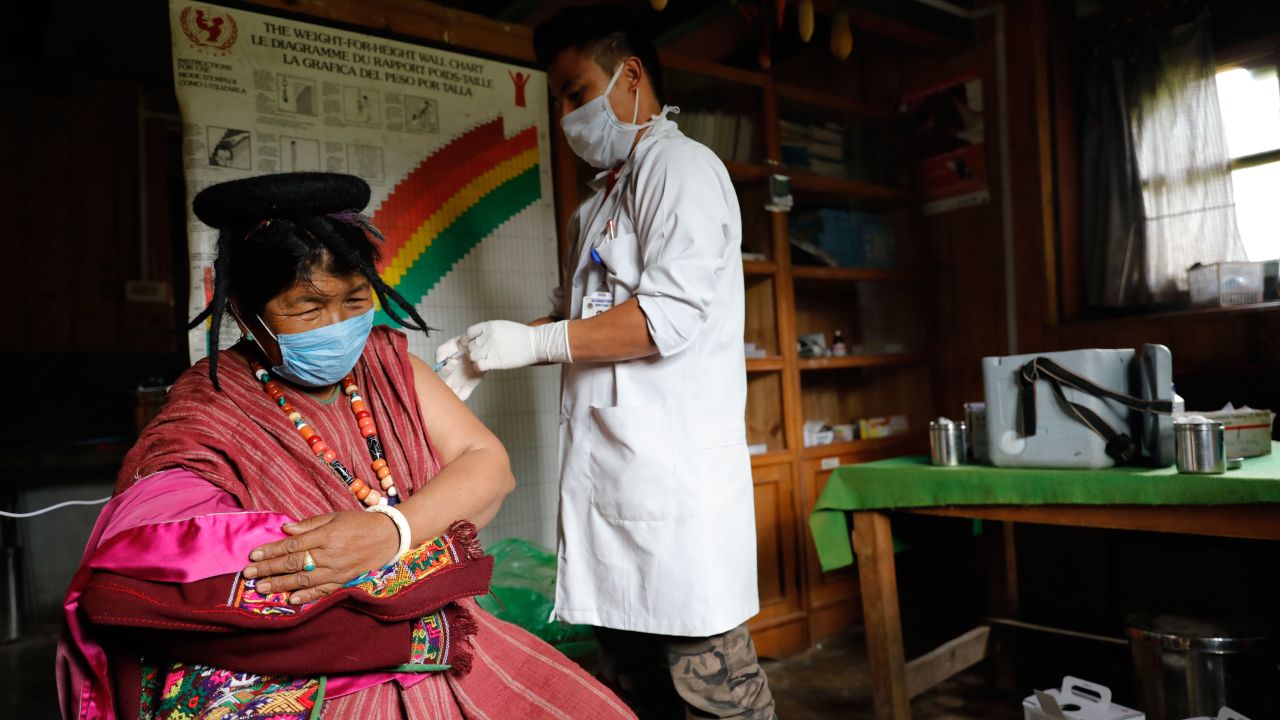 A resident of Sakteng village in far eastern district of Trashigang gets her second dose of Covid-19 vaccine at the community's health centre.