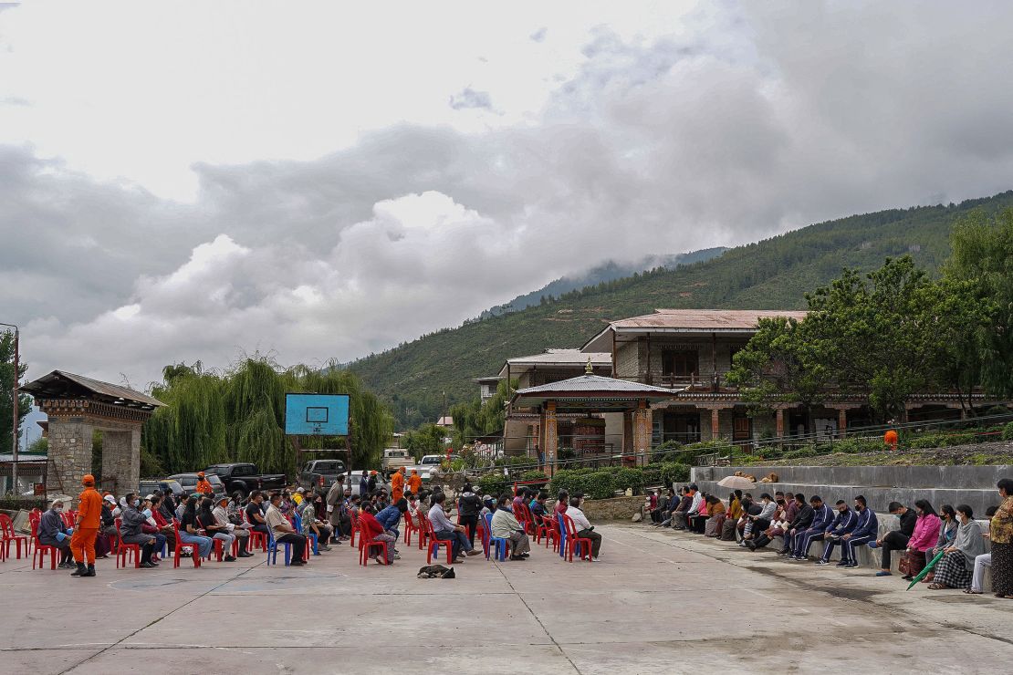 People queue up to register themselves and get inoculated with the Covid-19 coronavirus vaccine at a temporary vaccination centre in Thimpu on July 20.