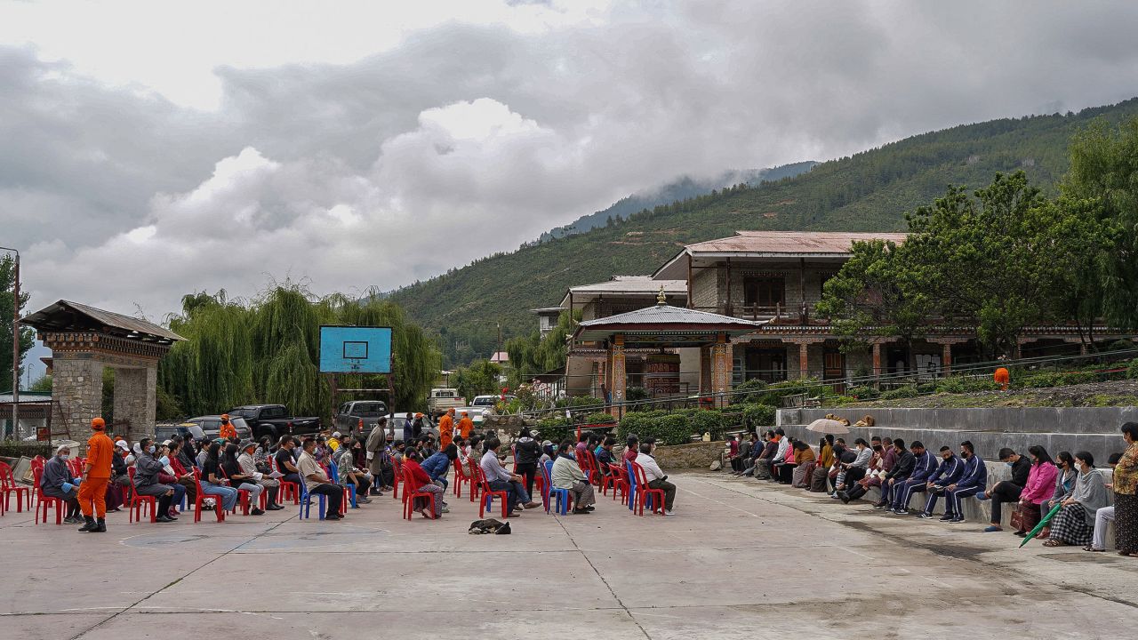People queue up to register themselves and get inoculated with the Covid-19 coronavirus vaccine at a temporary vaccination centre in Thimpu on July 20.