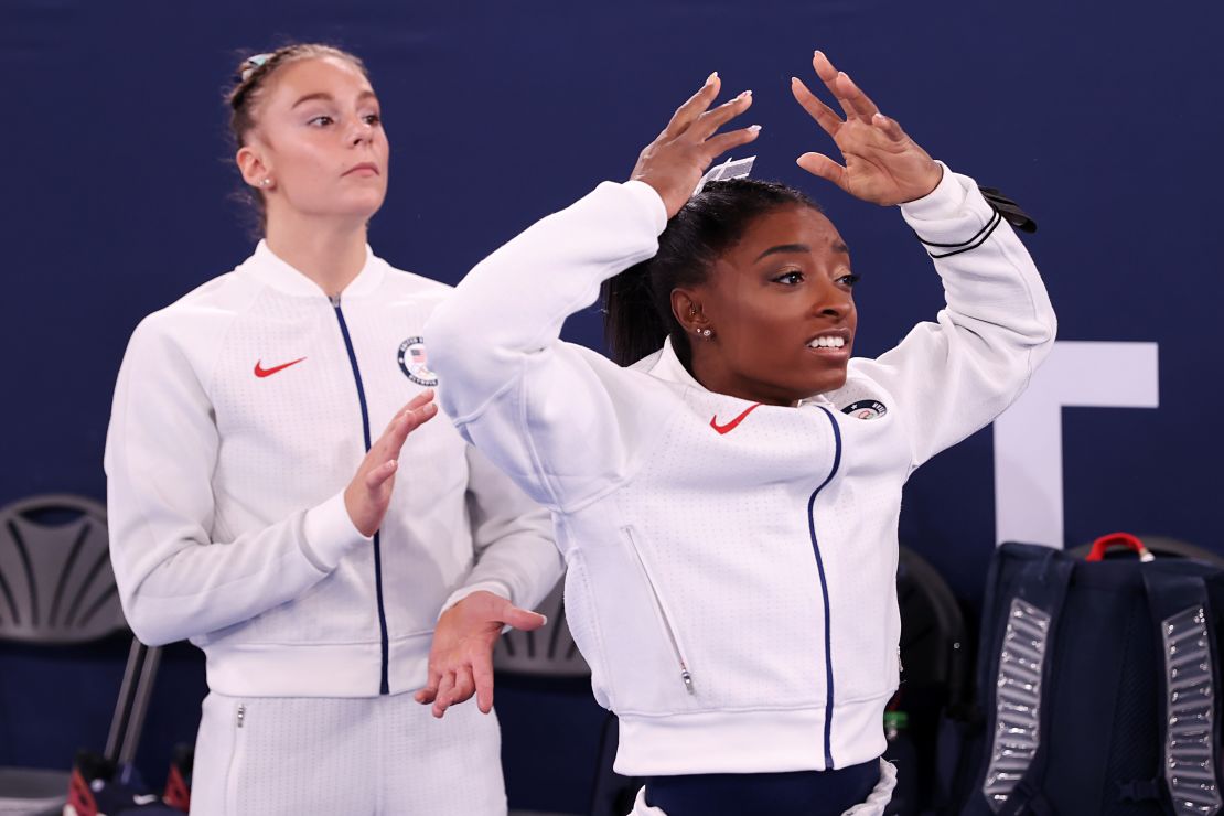 Grace McCallum (left) and Simone Biles react during the women's team final.