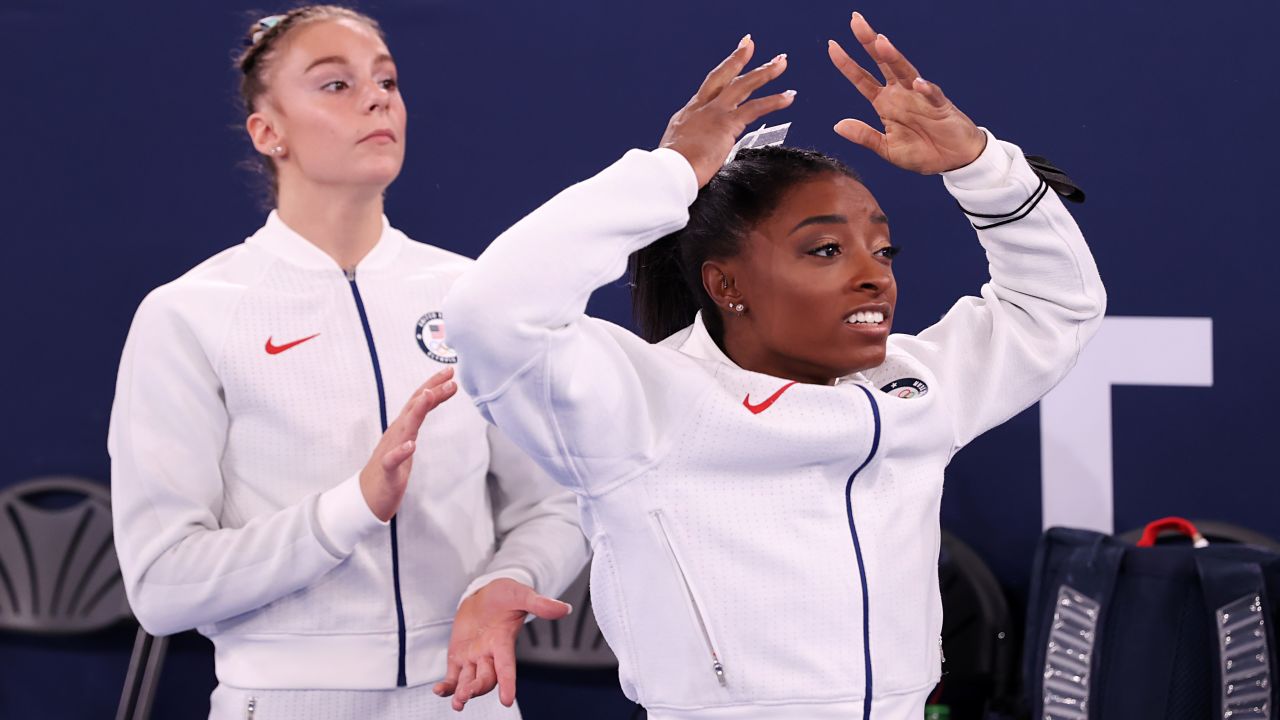 Grace McCallum (left) and Simone Biles react during the women's team final.