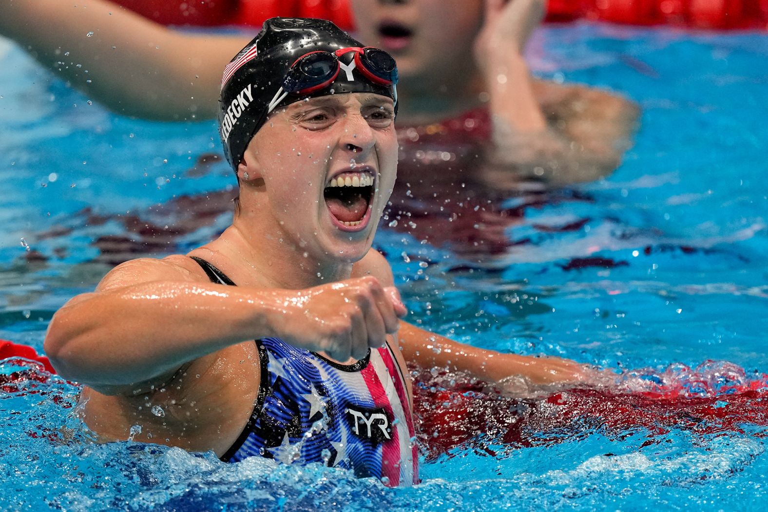 US swimmer Katie Ledecky celebrates after <a href="index.php?page=&url=https%3A%2F%2Fwww.cnn.com%2Fworld%2Flive-news%2Ftokyo-2020-olympics-07-27-21-spt%2Fh_86106ef469b0352fbf88fceea5aa405a" target="_blank">crushing the field in the 1,500-meter freestyle</a> on Wednesday, July 28. It was her sixth career gold medal and her eighth Olympic medal in all.