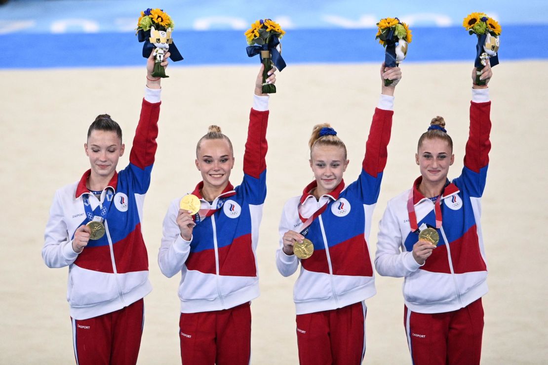 ROC's Liliia Akhaimova, Angelina Melnikova, Viktoriia Listunova and Vladislava Urazova celebrate on the podium.