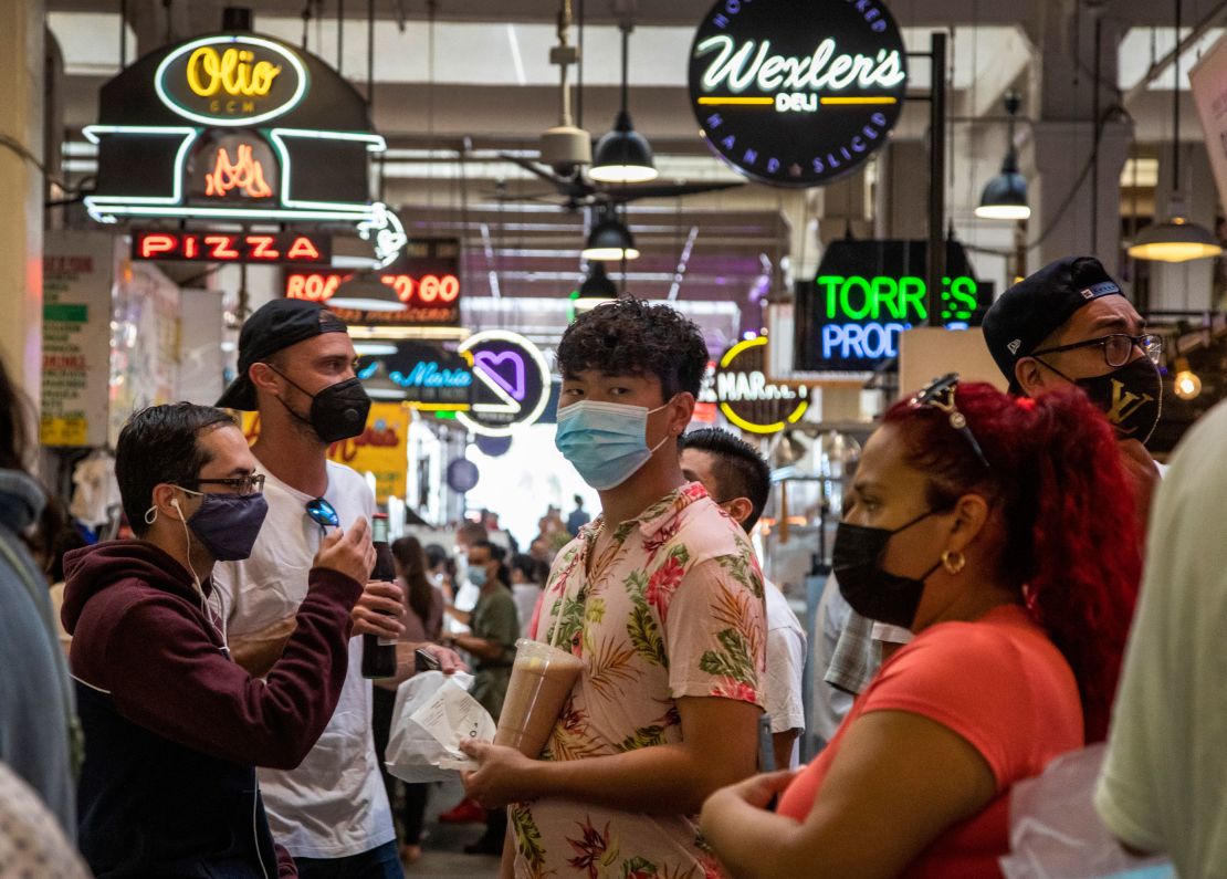 Visitors to the Grand Central Market in Los Angeles are mostly masked on Tuesday.