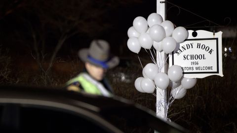 A state trooper stands guard at the entrance of Sandy Hook Elementary School on December 15, 2012, in Newtown, Connecticut.