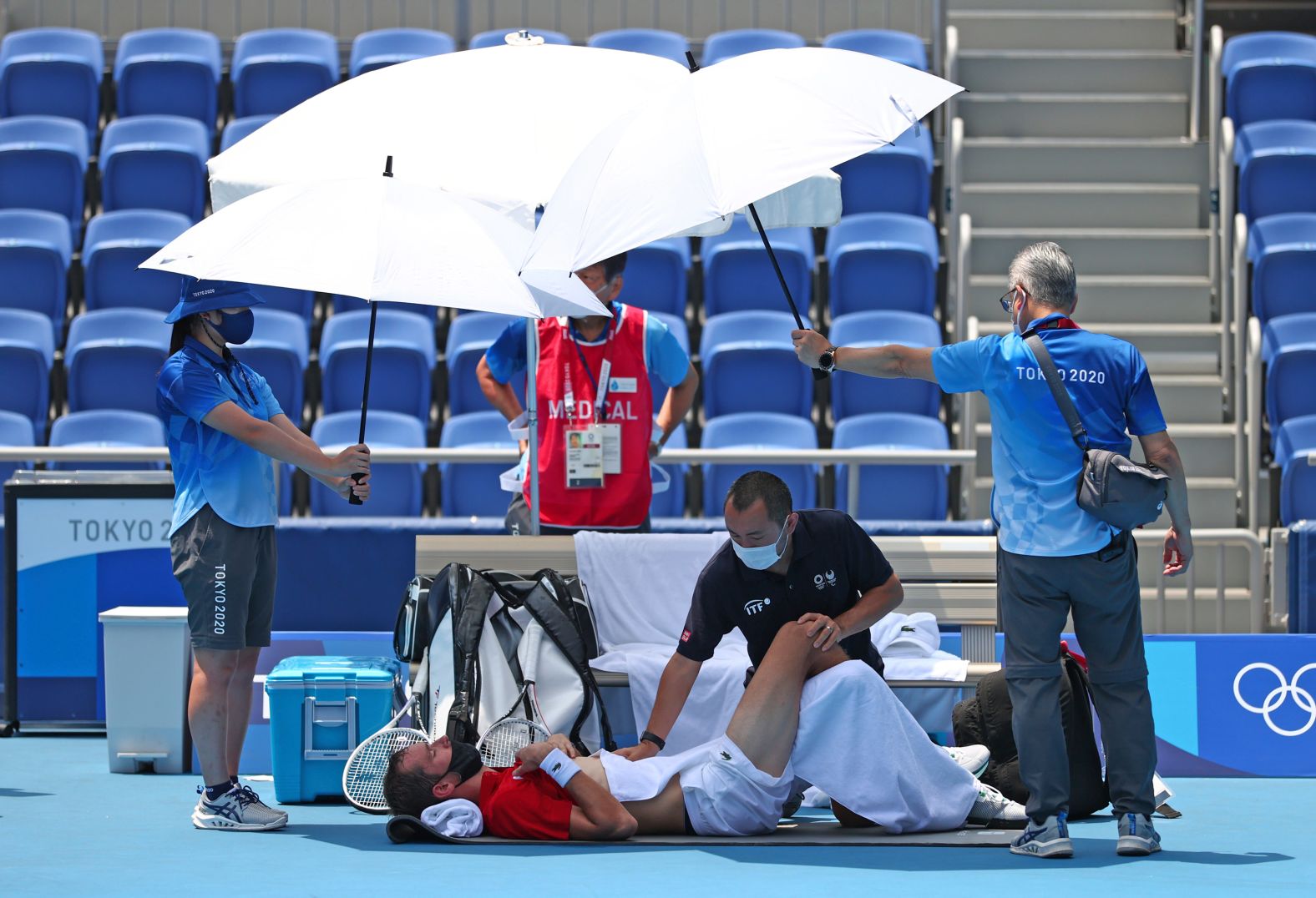Russian tennis player Daniil Medvedev receives medical treatment during his third-round singles match on July 28. Midway through the match, the Russian — known for his dry humor and sarcasm — approached the chair umpire <a href="index.php?page=&url=https%3A%2F%2Fwww.cnn.com%2Fworld%2Flive-news%2Ftokyo-2020-olympics-07-28-21-spt%2Fh_b0563c9d42927603e030f93c22bb2492" target="_blank">to ask what would happen if he died.</a> Medvedev went on to win the match over Italy's Fabio Fognini.