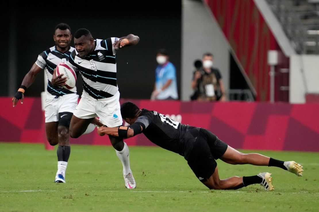 New Zealand's Sione Molia goes for the tackle on Asaeli Tuivuaka.