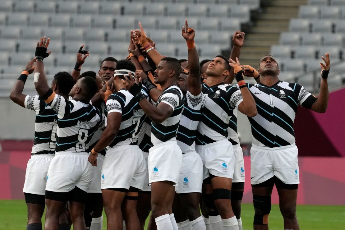 Fiji's players huddle together at the start of their gold medal match against New Zealand.