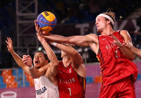 Serbia's Dusan Domovic Bulut, left, competes for the ball with Belgium's Rafael Bogaerts, center, and Thibaut Vervoort during a 3-on-3 basketball game on July 28. Serbia won the game for a bronze medal.