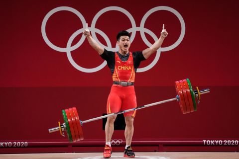 Chinese weightlifter Shi Zhiyong celebrates July 28 after winning gold in the 73-kilogram weight class. He lifted 166 kilograms in the snatch and 198 kilograms in the clean-and-jerk, setting <a href="https://www.cnn.com/world/live-news/tokyo-2020-olympics-07-28-21-spt/h_377e9649c19957df713a660d039f1d4e" target="_blank">a new world record total of 364 kilograms.</a>