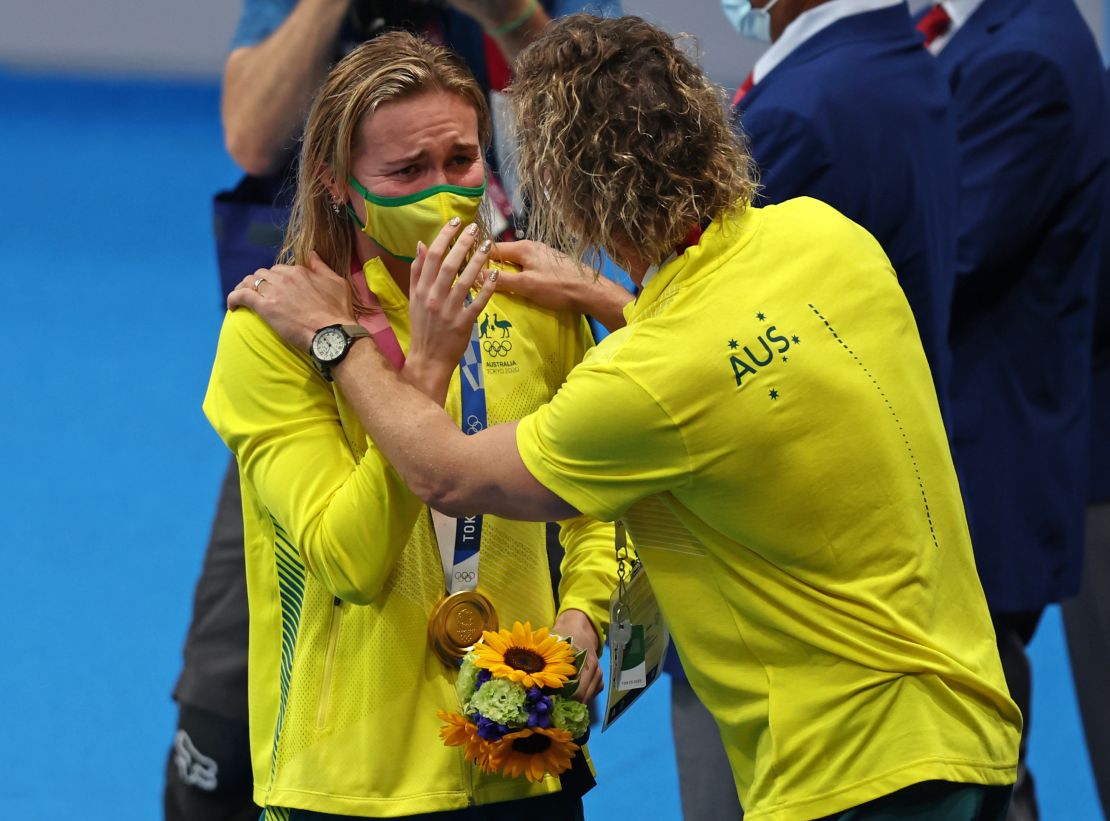 Titmus reacts with her coach Dean Boxall after winning the gold medal in the women's 200m freestyle.