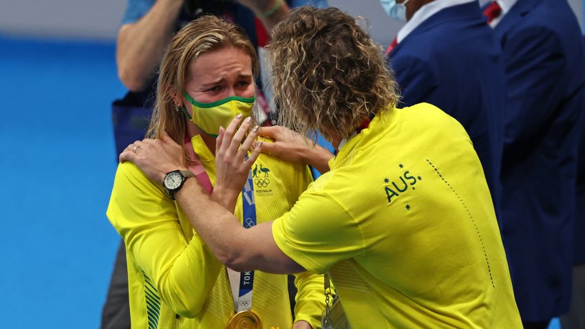 TOKYO, JAPAN - JULY 28: Ariarne Titmus of Team Australia reacts with her coach Dean Boxall of Team Australia after winning the gold medal in the Women's 200m Freestyle Final on day five of the Tokyo 2020 Olympic Games at Tokyo Aquatics Centre on July 28, 2021 in Tokyo, Japan. (Photo by Clive Rose/Getty Images)
