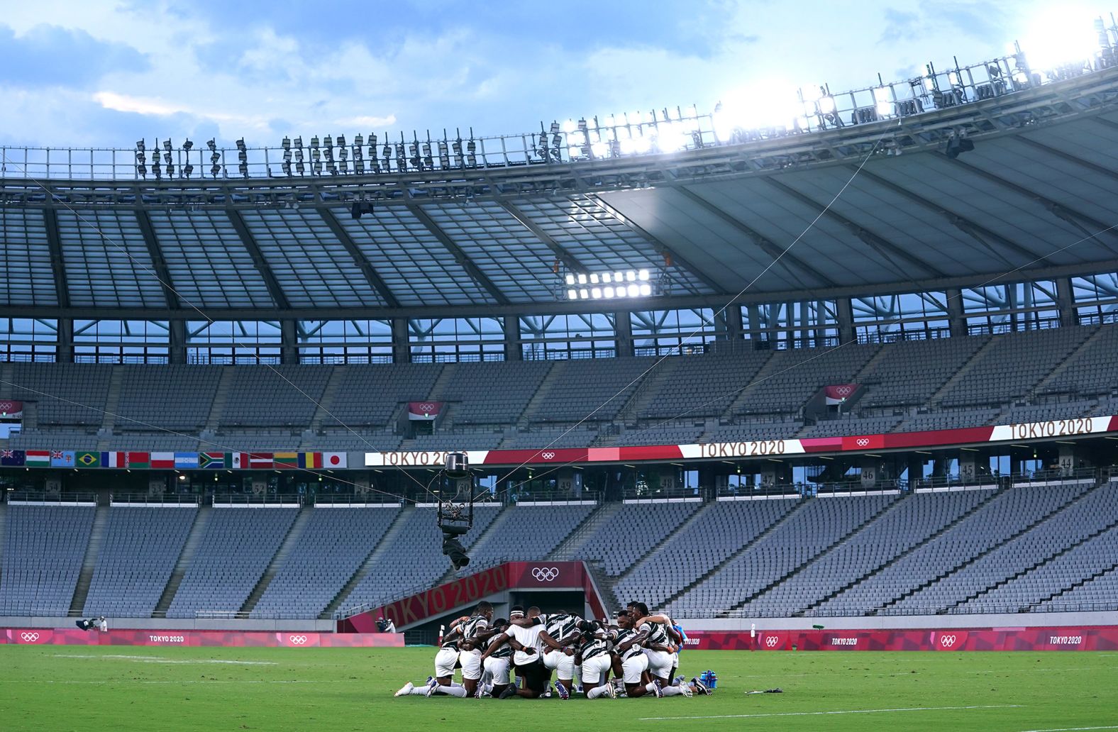 Fiji players celebrate after winning gold in rugby sevens on July 28.