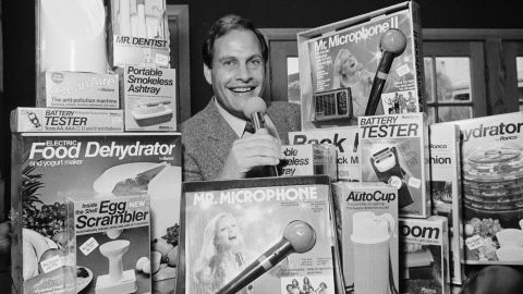 In this 1982 photo, Ron Popeil, the man behind those late-night, rapid-fire television commercials that sell everything from the Mr. Microphone to the Pocket Fisherman to the classic Veg-a-Matic, sits surrounded by his wares in his office in Beverly Hills, Calif. 
