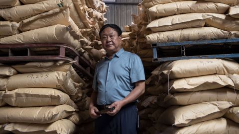 Chinese pig farmer Sun Dawu posing at a feed warehouse in Hebei, outside Beijing, on September 24, 2019. 