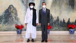 In this photo released by China's Xinhua News Agency, Taliban co-founder Mullah Abdul Ghani Baradar, left, and Chinese Foreign Minister Wang Yi pose for a photo during their meeting in Tianjin, China, Wednesday, July 28, 2021. Wang met with a delegation of high-level Taliban officials as ties between them warm ahead of the U.S. pullout from Afghanistan. (Li Ran/Xinhua via AP)