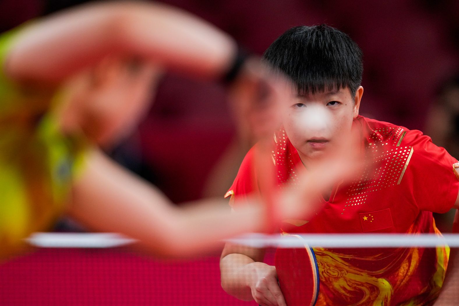 China's Sun Yingsha waits for a serve from Japan's Mima Ito during a table-tennis semifinal on July 29. Sun won to advance to the final.