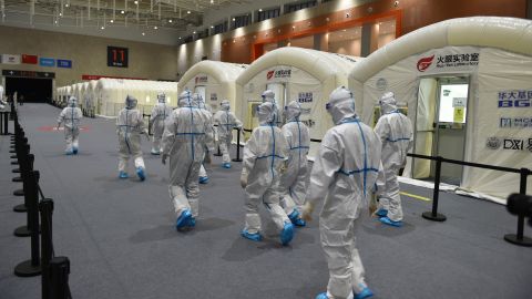 Workers prepare a pop-up Covid-19 testing lab at an expo center in Nanjing, China, on July 28.