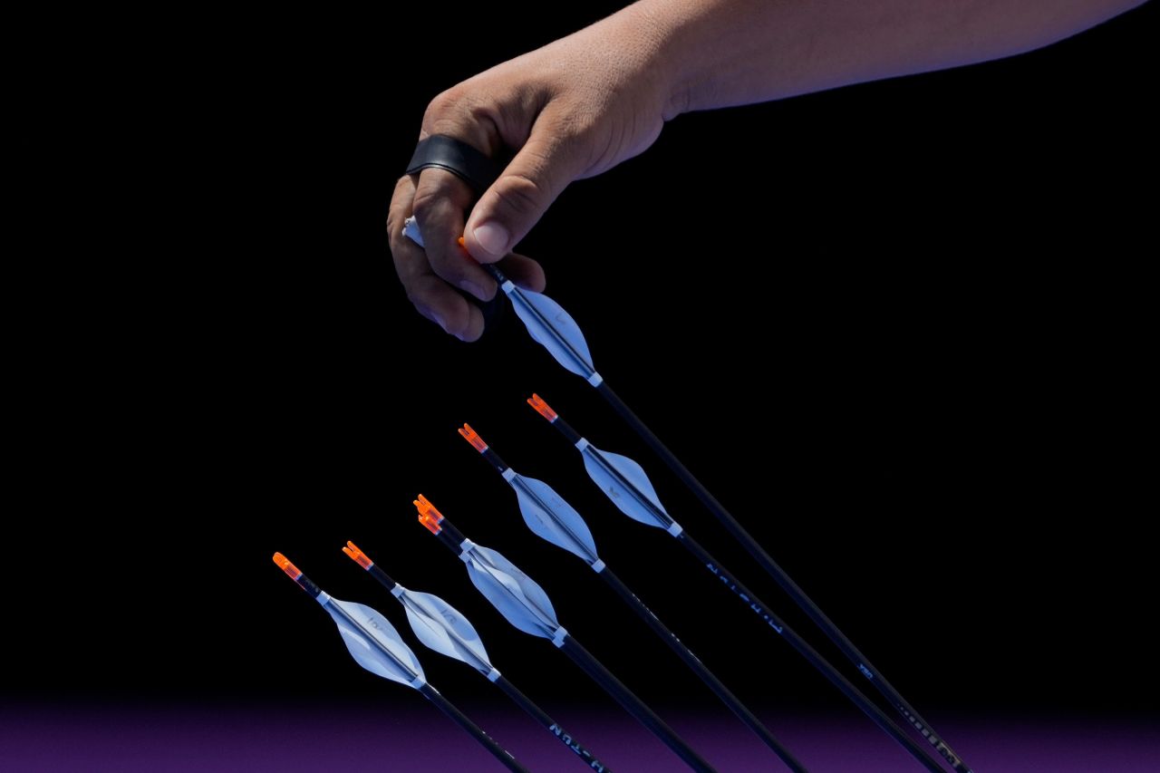 Tunisia's Mohamed Hammed picks an arrow during archery competition on July 29.