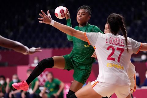 Brazil's Bruna de Paula is defended by  Spain's Lara González Ortega during a preliminary round handball match on July 29.