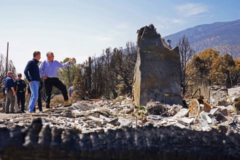 California Gov. Gavin Newsom, left, and Nevada Gov. Steve Sisolak tour an area destroyed by the Tamarack Fire in Gardnerville, Nevada, on July 28. 