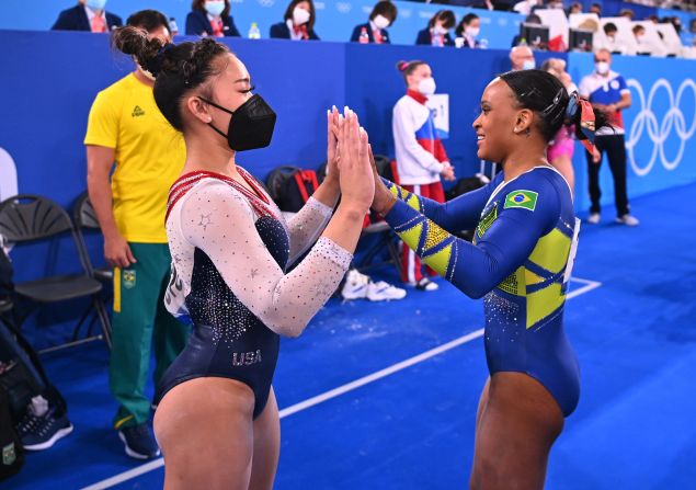 Lee congratulates Brazil's Rebeca Andrade after the floor exercise. Andrade had a chance to overtake Lee at the end, but she stepped out of bounds twice during her floor routine.