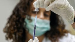 A medic prepares a dose of the Pfizer-BioNTech Covid-19 vaccine at the Clalit Healthcare Services in Holon, Israel last month. 