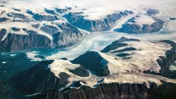Western coast of Greenland, aerial view of glacier,  mountains and ocean.