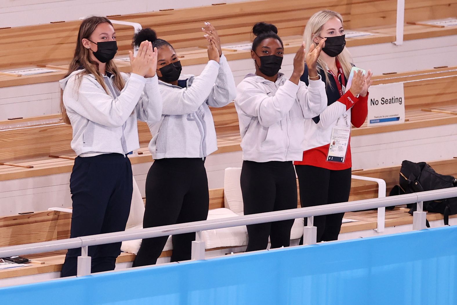 From left, US gymnasts Grace McCallum, Jordan Chiles, Simone Biles and MyKayla Skinner cheer for teammate Suni Lee after her gold-medal performance on July 29. Biles, the defending champion, <a href="index.php?page=&url=https%3A%2F%2Fwww.cnn.com%2F2021%2F07%2F28%2Fsport%2Fsimone-biles-gymnastics-tokyo-2020-mental-health-spt-intl%2Findex.html" target="_blank">withdrew from the event</a> because of mental-health concerns. <em>Correction: This caption has been updated to include Grace McCallum, who was previously misidentified by Getty Images.</em>