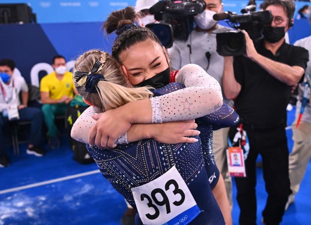 Lee is congratulated by teammate Jade Carey after winning the gold.