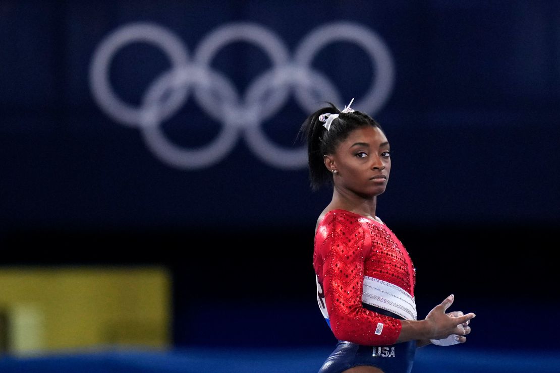 Simone Biles, of the United States, waits to perform on the vault during the artistic gymnastics women's final at the 2020 Summer Olympics, Tuesday, July 27, 2021, in Tokyo.