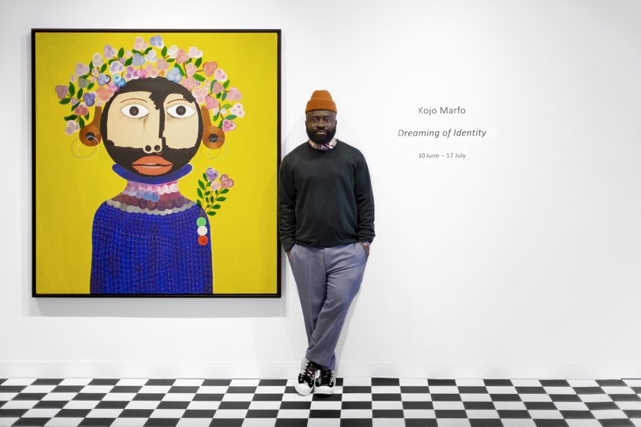 Ghanaian artist Kojo Marfo poses with one of the pieces from his sold-out solo exhibition, "Dreaming of Identity," which opened this summer at JD Malat Gallery, London.