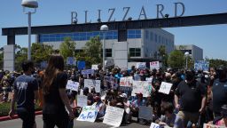 Employees gather for a group photo during a walkout at Activision Blizzard offices in Irvine, California, U.S., on Wednesday, July 28, 2021. Activision Blizzard Inc. employees called for the walkout on Wednesday to protest the company's responses to a recent sexual discrimination lawsuit and demanding more equitable treatment for underrepresented staff. 