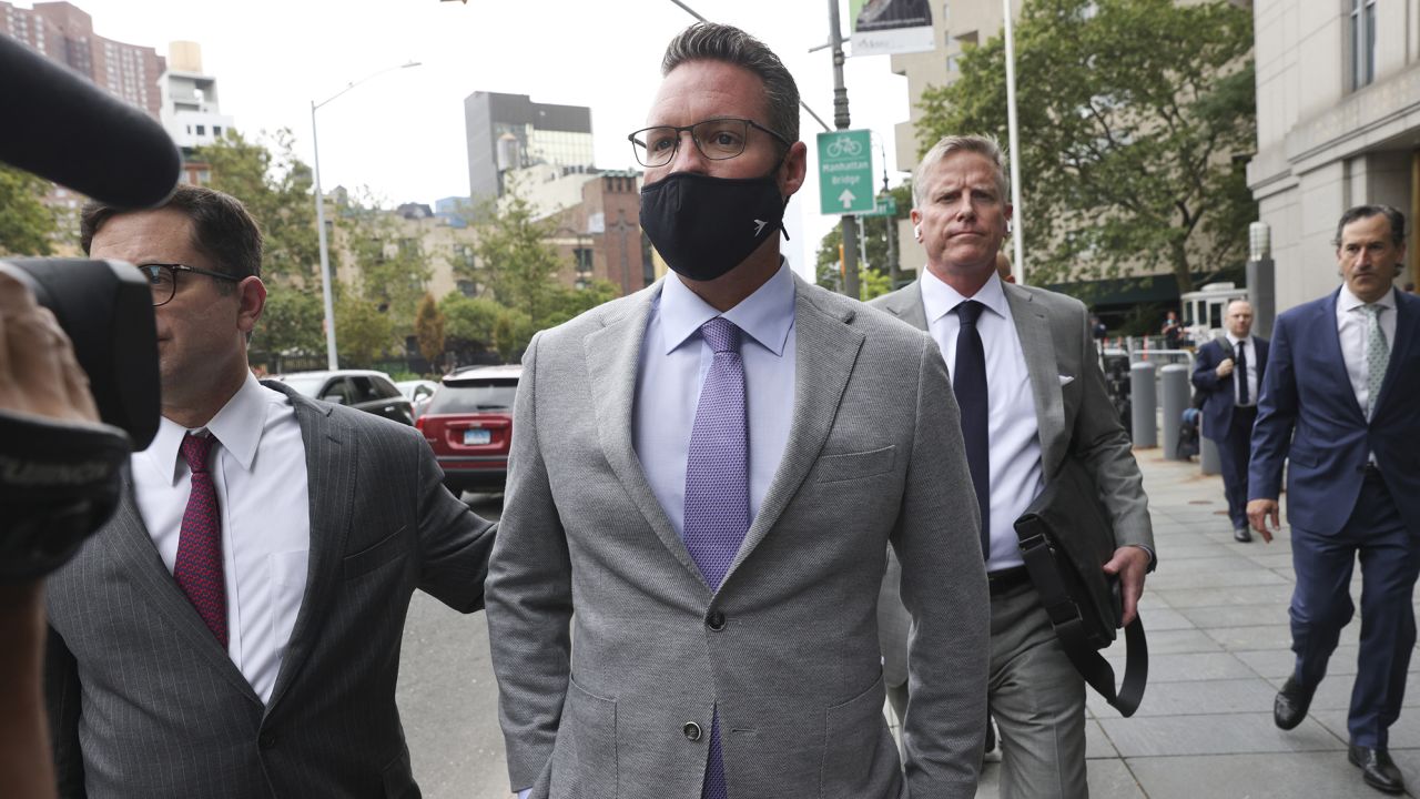 Trevor Milton, founder of Nikola Corp., center, exits federal court in New York, U.S., on Thursday, July 29, 2021. Milton is charged with misleading investors from November 2019 until around September 2020 about the development of Nikolas products and technology, according to an indictment unsealed Thursday by federal prosecutors in N.Y.